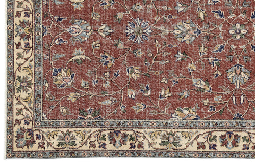 Load image 1 in gallery view. Terracotta red traditional rug with a floral vine pattern and a cream border featuring intricate botanical motifs.