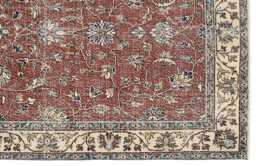 Load image 1 in gallery view. Terracotta rug with a traditional floral vine pattern, blue and cream accents, and a wide cream border.