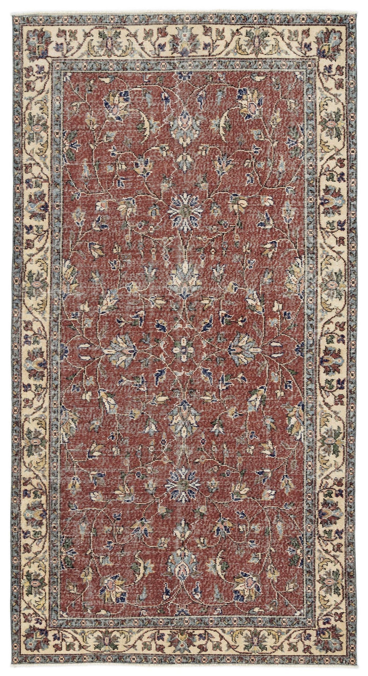 Rust-red traditional rug with a central floral vine pattern and a cream and blue decorative border.