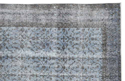 Load image 1 in gallery view. Blue and charcoal grey distressed rug with a traditional floral medallion pattern and a wide decorative border.