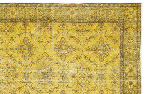 Load image 1 in gallery view. Mustard yellow and brown distressed rug with a traditional floral medallion pattern and a decorative border.