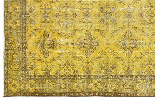 Load image 1 in gallery view. Mustard yellow and brown distressed rug with a traditional floral medallion pattern and a wide decorative border.
