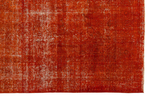 Load image 1 in gallery view. Burnt orange distressed rug with a faded, traditional overdyed pattern on a white background.