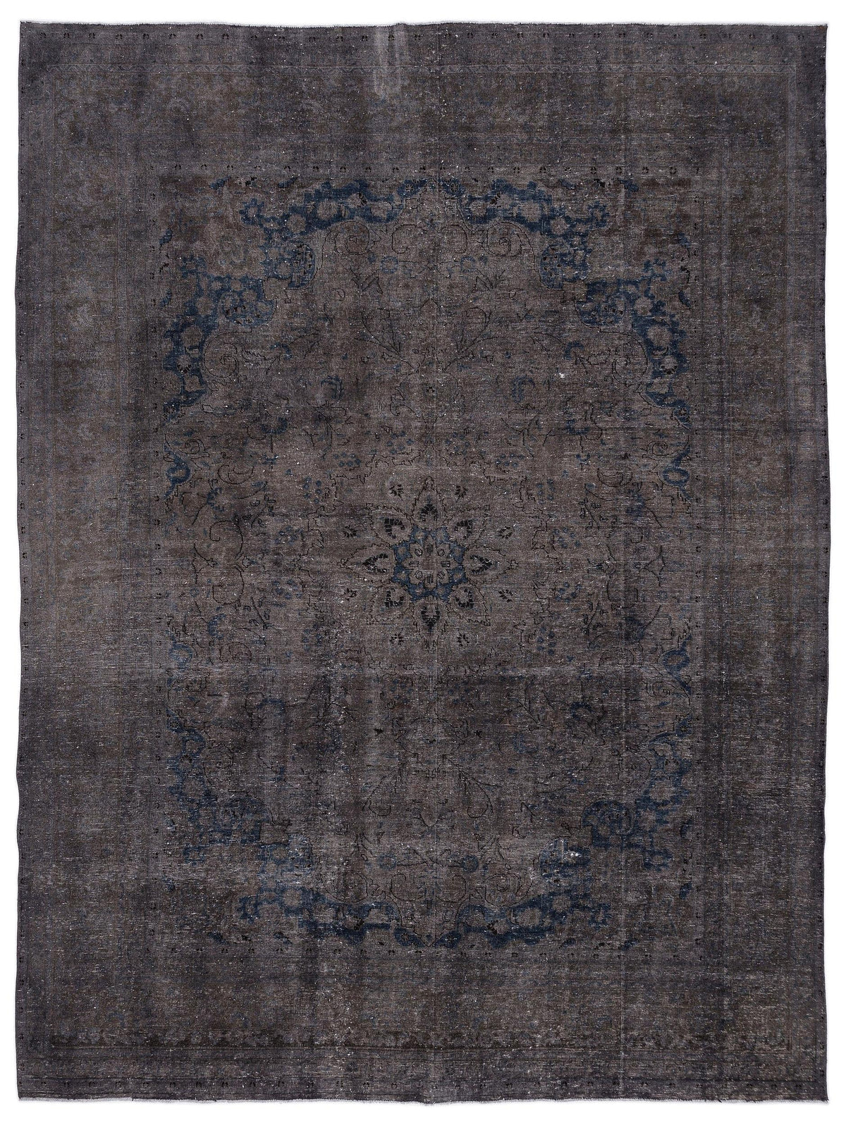 Dark charcoal and navy blue distressed rug with a traditional central floral medallion and ornate border.