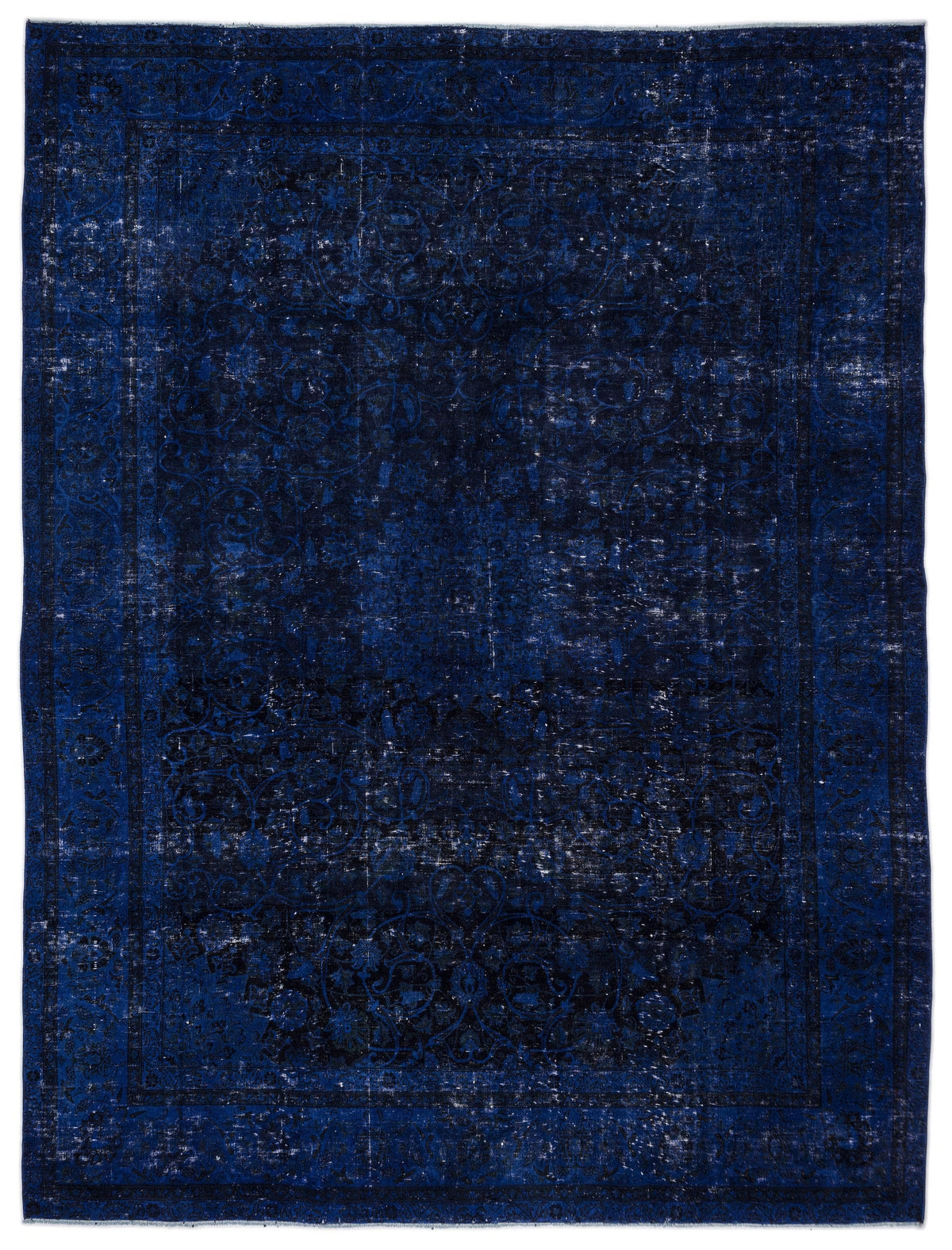 Deep blue and black distressed traditional rug with a faded ornate floral medallion pattern.