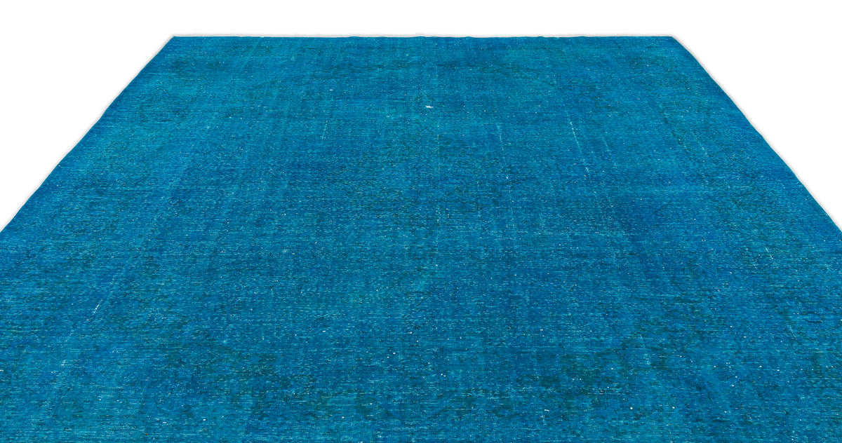 Solid bright blue vintage-style rug with a distressed, weathered texture on a white background.