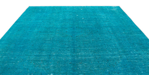 Load image 1 in gallery view. Solid turquoise rug with a distressed, weathered texture and subtle dark flecks on a white background.