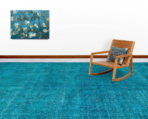 Load image 1 in gallery view. Solid teal distressed-texture rug in a room with a wooden rocking chair and wall art.