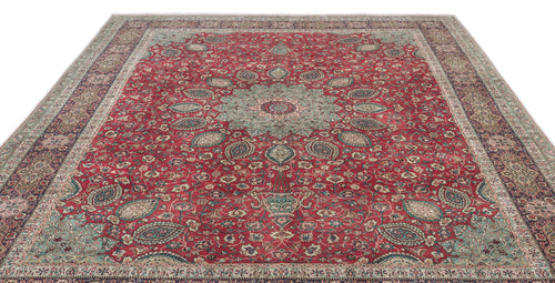 Load image 1 in gallery view. Red traditional Persian-style rug with a central floral medallion, intricate botanical motifs, and a wide decorative border.