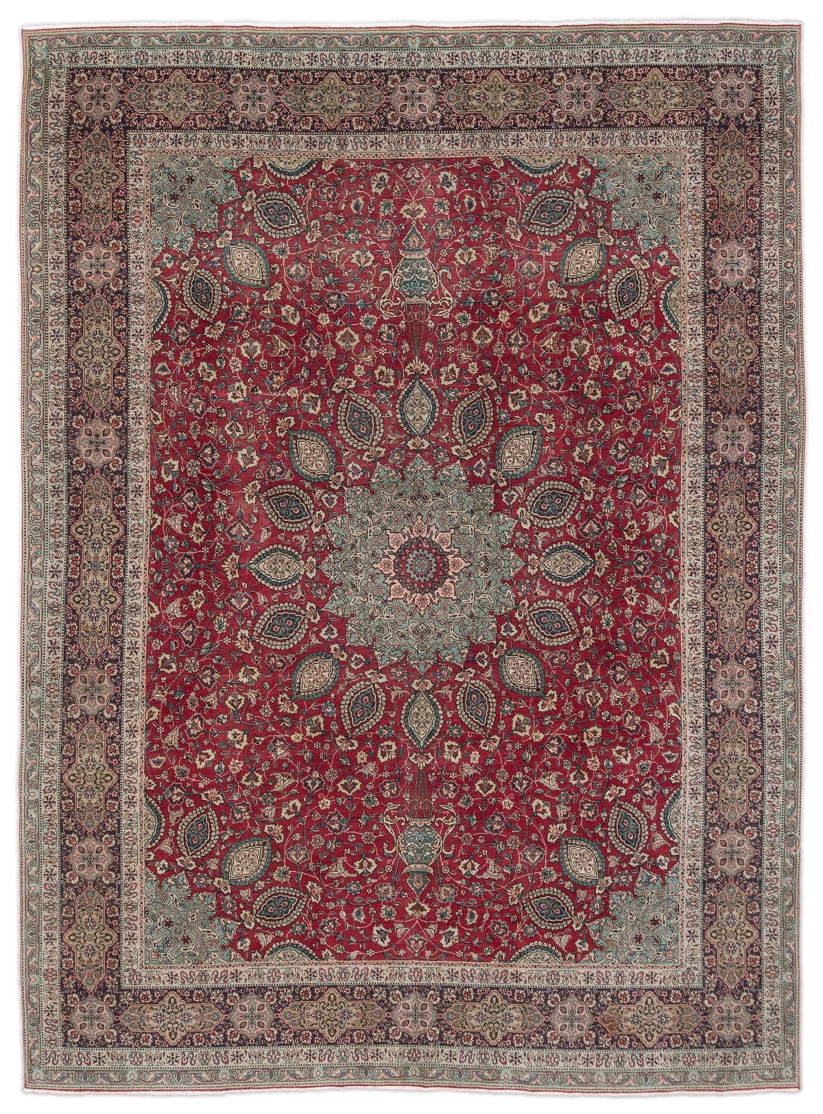 Traditional red Persian-style rug with a central blue floral medallion, intricate botanical motifs, and a dark border.