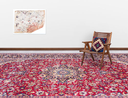 Load image 1 in gallery view. Red traditional Persian-style rug with a central floral medallion, styled in a room with a wooden chair and wall map.