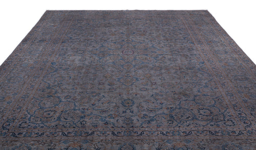 Load image 1 in gallery view. Distressed charcoal and blue traditional rug with a central floral medallion and intricate border on a white background.