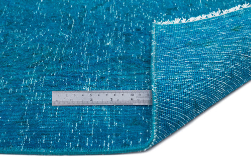 Load image 1 in gallery view. Teal distressed rug with white flecked texture and white fringe, shown with a metal ruler for scale.