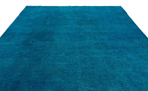 Load image 1 in gallery view. Solid teal area rug with a distressed, weathered texture on a white background.