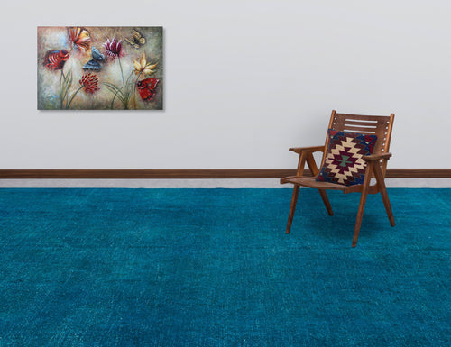 Load image 1 in gallery view. Solid teal area rug in a room with a wooden chair and butterfly wall art.