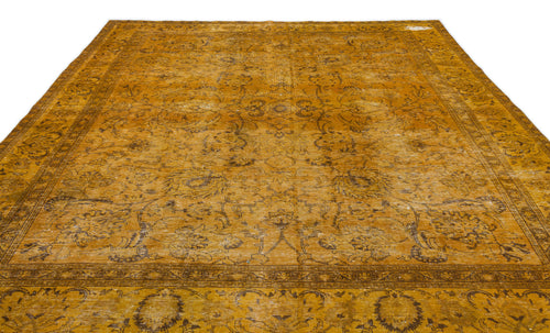 Load image 1 in gallery view. Distressed mustard yellow rug with a dark brown traditional floral medallion pattern and a wide decorative border.