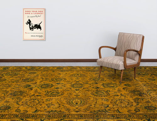 Load image 1 in gallery view. Mustard yellow and dark green traditional floral medallion rug in a room with a patterned armchair and wall art.