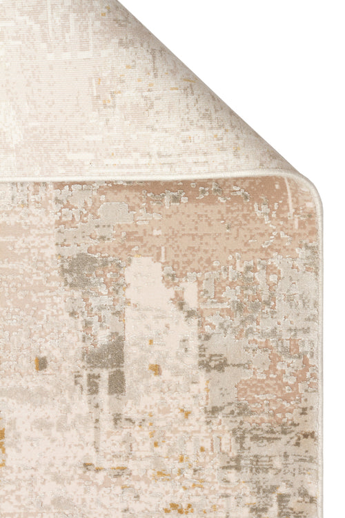 Load image 1 in gallery view. Beige, cream, and grey rug with a distressed, abstract pattern, shown with a corner folded over on a white background.