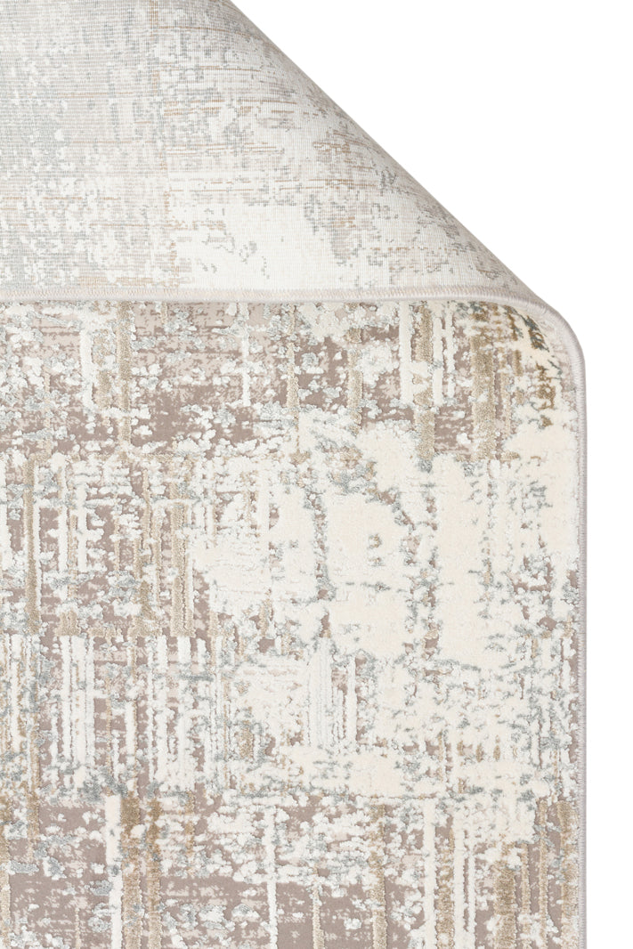 Beige, cream, and light gray rug with a distressed, abstract textured pattern, shown with a folded corner.