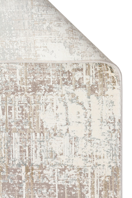 Load image 1 in gallery view. Beige, cream, and light gray rug with a distressed, abstract textured pattern, shown with a folded corner.