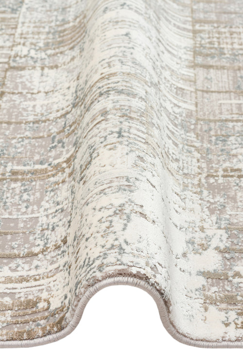 Load image 1 in gallery view. Beige, cream, and slate blue area rug with a distressed, abstract linear pattern and a serged edge.