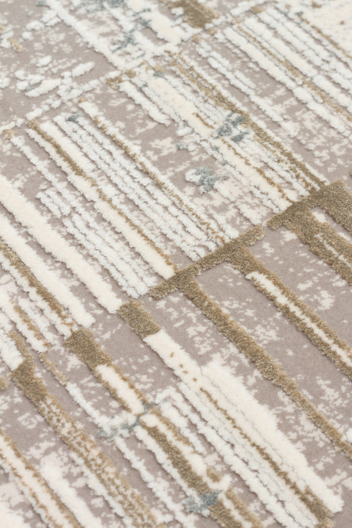 Taupe and cream rug with a high-low pile featuring an abstract linear grid pattern.