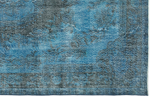 Load image 1 in gallery view. Blue and black distressed rug with a faded traditional medallion pattern and a dark border.
