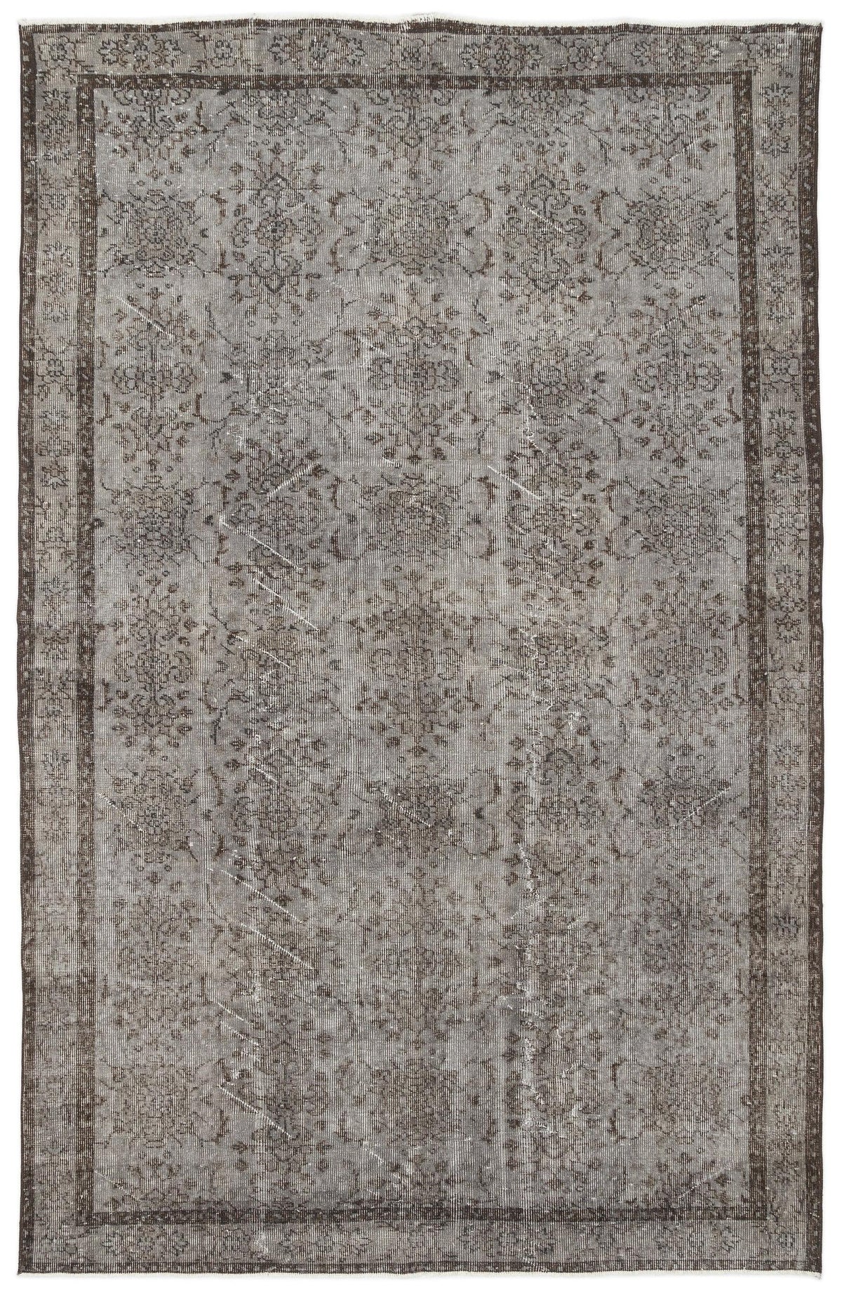Grey and charcoal distressed vintage-style rug with a faded traditional floral medallion pattern and a bordered edge.