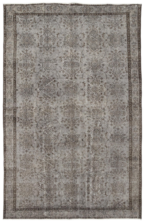 Load image 1 in gallery view. Grey and charcoal distressed vintage-style rug with a faded traditional floral medallion pattern and a bordered edge.