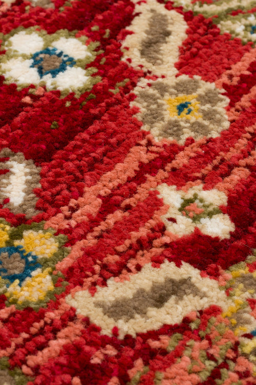 Load image 1 in gallery view. Red, high-pile rug with a multi-colored floral pattern in cream, yellow, blue, and olive green.