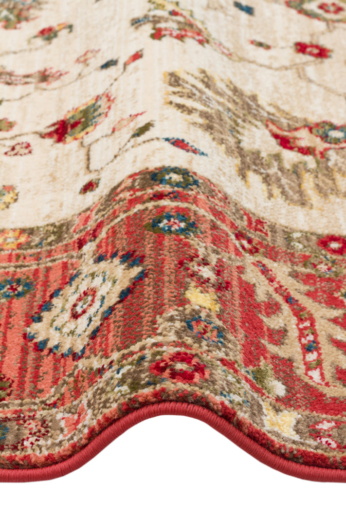 Cream, red, and olive traditional floral medallion rug with a detailed border, shown on a white background.