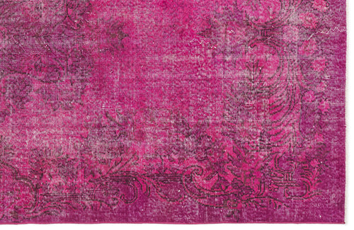 Load image 1 in gallery view. Magenta rug with a distressed, dark floral medallion pattern and a visible woven texture.
