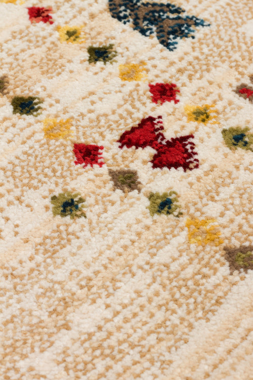 Load image 1 in gallery view. Cream-colored high-pile rug with a scattered pattern of small red, yellow, blue, and green geometric motifs.