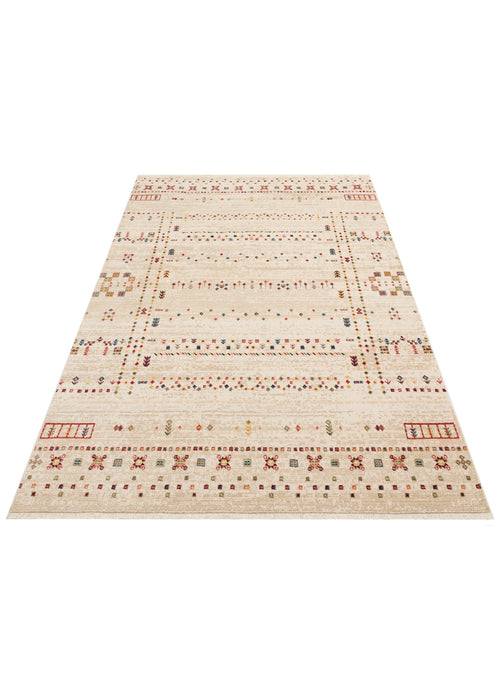 Load image 1 in gallery view. Cream area rug with a distressed finish, featuring multicolored geometric tribal motifs and a fringed edge.
