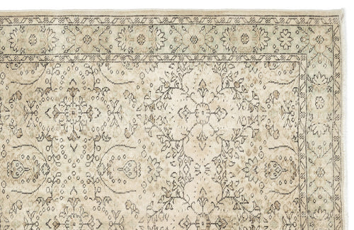 Load image 1 in gallery view. Beige and cream traditional rug with a faded floral medallion pattern and a detailed geometric border.