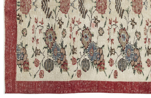 Load image 1 in gallery view. Cream rug with a distressed floral pattern in red, blue, and brown, featuring a wide red border.