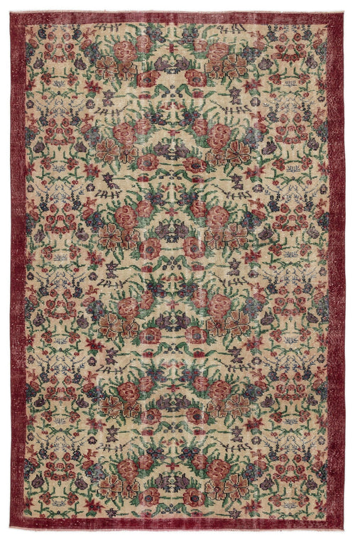 Load image 1 in gallery view. Beige rug with a distressed floral pattern in red, green, and blue, featuring a wide dark red border.