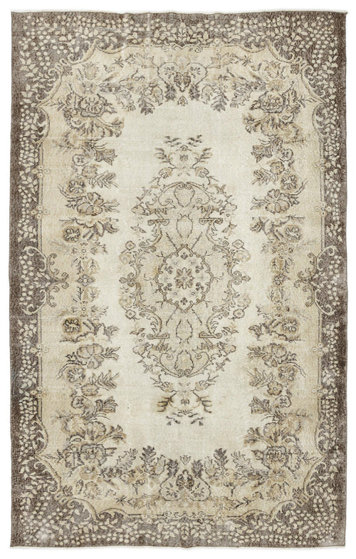 Load image 1 in gallery view. Beige and brown vintage-style rug with a central floral medallion and ornate border pattern.