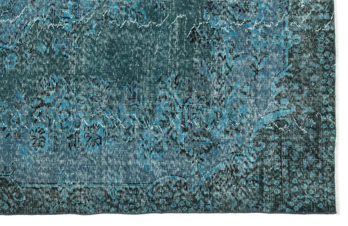 Load image 1 in gallery view. Teal and black distressed rug with a traditional floral medallion pattern on a white background.