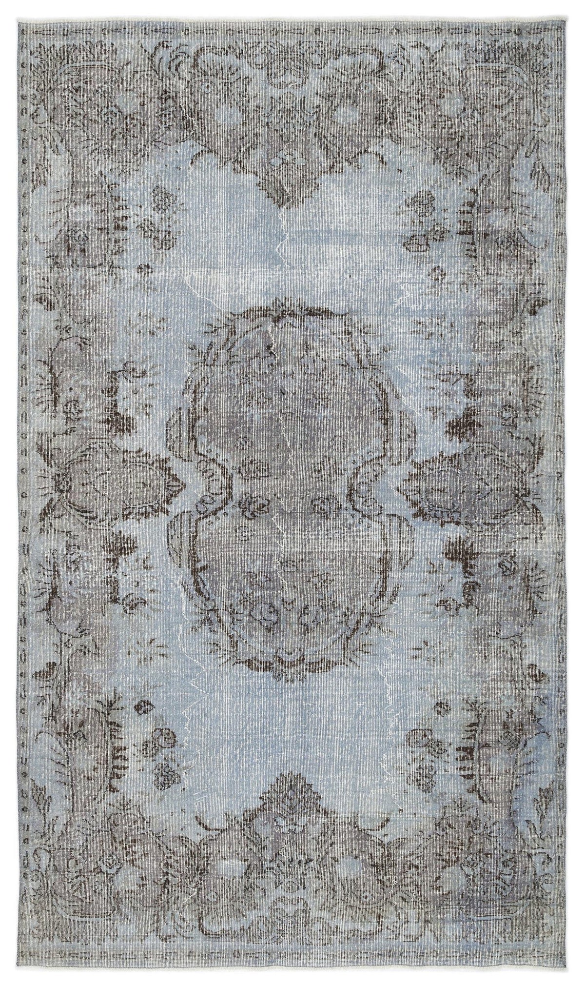 Light blue and charcoal grey distressed rug with a central medallion and ornate floral border.