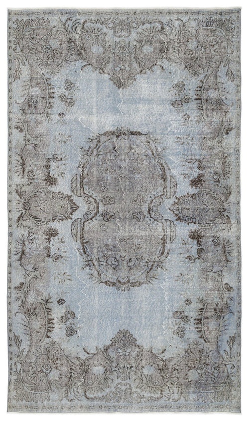 Load image 1 in gallery view. Light blue and charcoal grey distressed rug with a central medallion and ornate floral border.