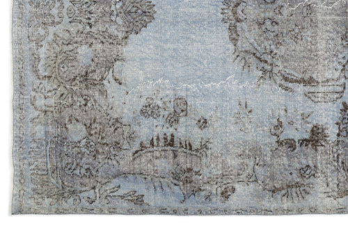 Load image 1 in gallery view. Light blue and charcoal grey rug with a distressed, faded traditional floral medallion pattern.