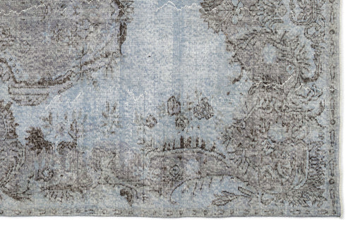 Load image 1 in gallery view. Light blue and charcoal grey distressed rug with a faded traditional floral medallion pattern.