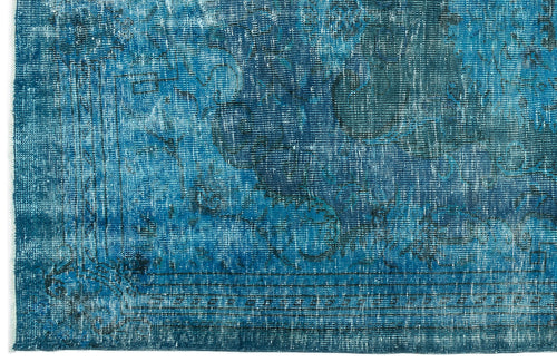 Load image 1 in gallery view. Distressed blue and navy rug with a faded traditional medallion pattern and a linear border.