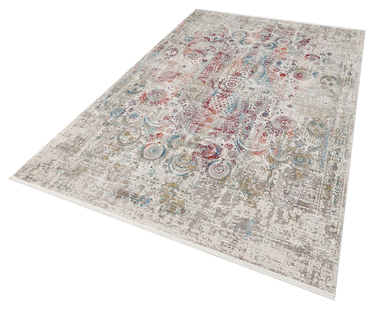 Distressed cream rug with a multi-colored floral medallion pattern in red, blue, and gold on a white background.