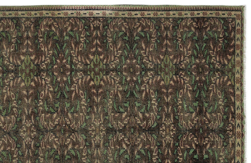 Load image 1 in gallery view. Dark brown traditional rug with a repeating floral vine pattern in olive green and tan, featuring a detailed border.
