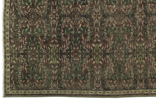 Load image 1 in gallery view. Dark brown and green traditional rug with a repeating floral medallion pattern and a narrow decorative border.