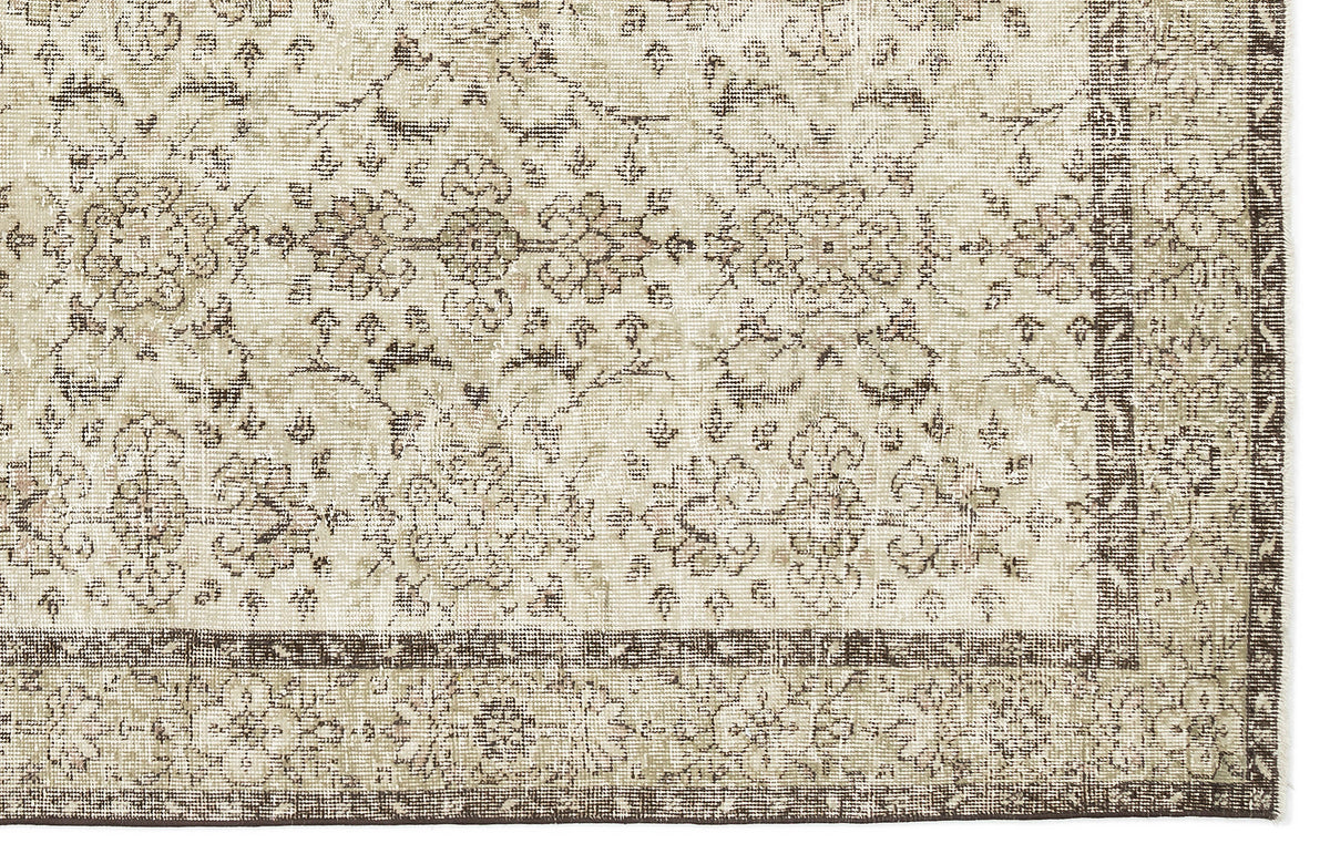 The Lagata - Vintage Floral Rug (6'2" x 9'9") features a beige and brown ornate, symmetrical floral and vine pattern with a decorative border for a classic vintage look.