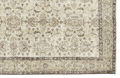 Load image 1 in gallery view. The Lagata - Vintage Floral Rug (6'2" x 9'9") features a beige and brown ornate, symmetrical floral and vine pattern with a decorative border for a classic vintage look.