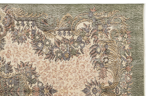 Load image 1 in gallery view. Sage green and cream rug with a traditional floral medallion pattern and distressed texture.